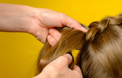Hair plaiting brown hair