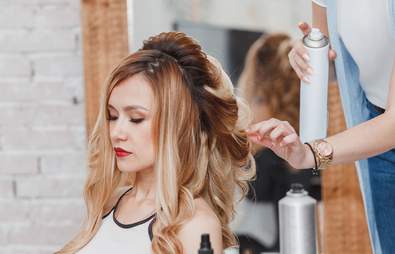 model getting her hair styled